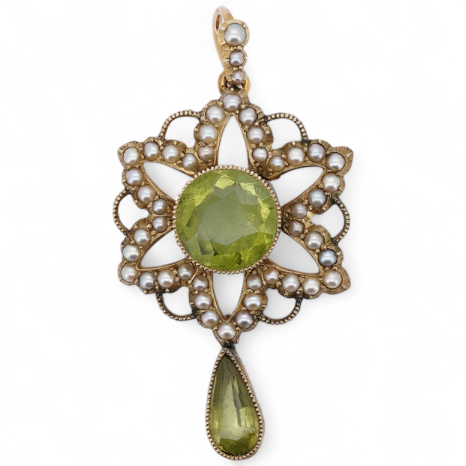 An Edwardian 15ct, peridot and seed pearl cluster pendant, set with circular and pear cut peridot, overall 39mm.